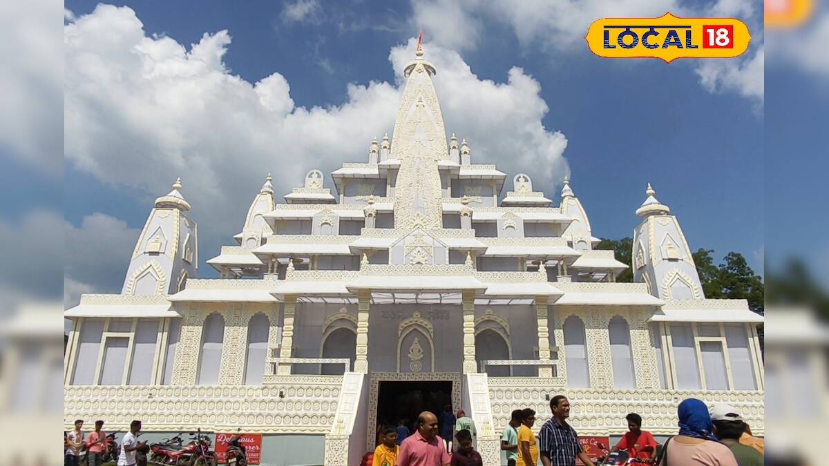 Adra Bengali Samiti’s white pandal shown in 2025 news coverage